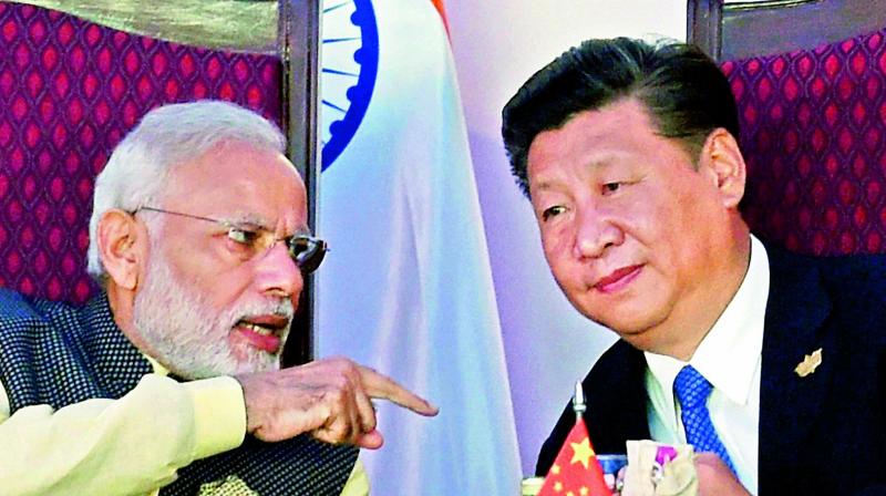Prime Minister Narendra Modi with Chinese President Xi Jinping during Brics Summit in Goa on Sunday (Photo: AP)