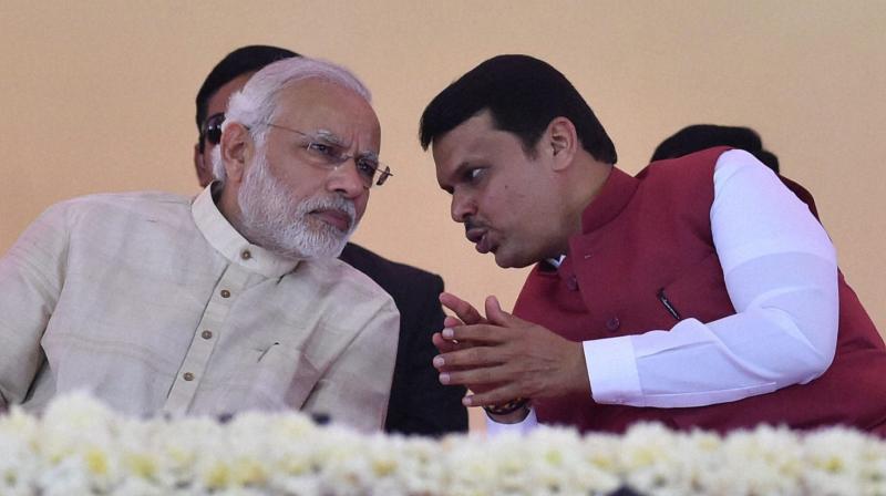 Prime Minister Narendra Modi with Maharashtra CM Devendra Fadnavis. (Photo: PTI)
