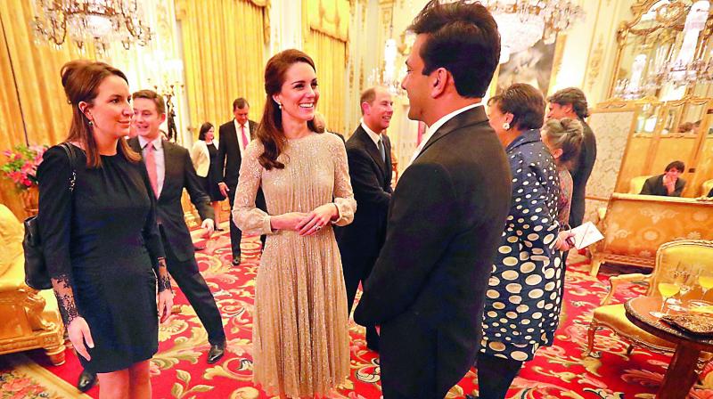 Britains Kate, the Duchess of Cambridge, talks to chef Vikas Khanna at Buckingham Palace (photo: AP)