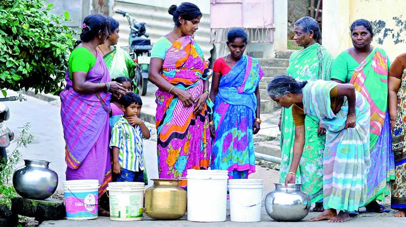 Locals line up to fill water from a borewell in Tadepalli on Friday. 	(Photo: DC)