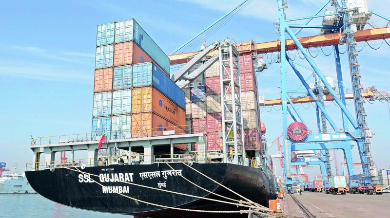 A file photo of container cargo ship and containers at Visakha Container Terminal Private Limited in Visakhapatnam.
