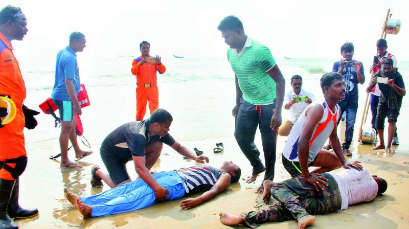 Members of the NDRF, fire department, police and fisheries conduct a mock drill of tsunami at Konapapapeta village in East Godavari on Friday. (Photo: DC)