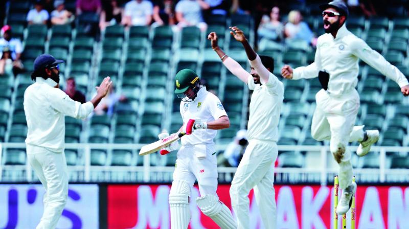 South Africas AB de Villiers (second from left) leaves the field as Indian players celebrate his dismissal on the fourth day of their third Test match at the Wanderers Stadium in Johannesburg, South Africa, on Saturday. (Photo: AP)