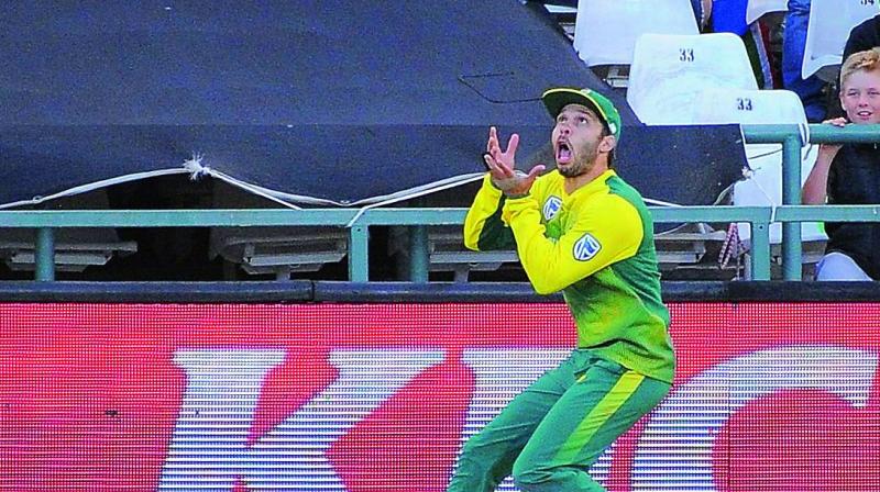 South Africas Farhaan Behardien goes for a catch during their third T20 cricket match against India at Newlands Cricket Ground on Saturday in Cape Town. (Photo:AFP)
