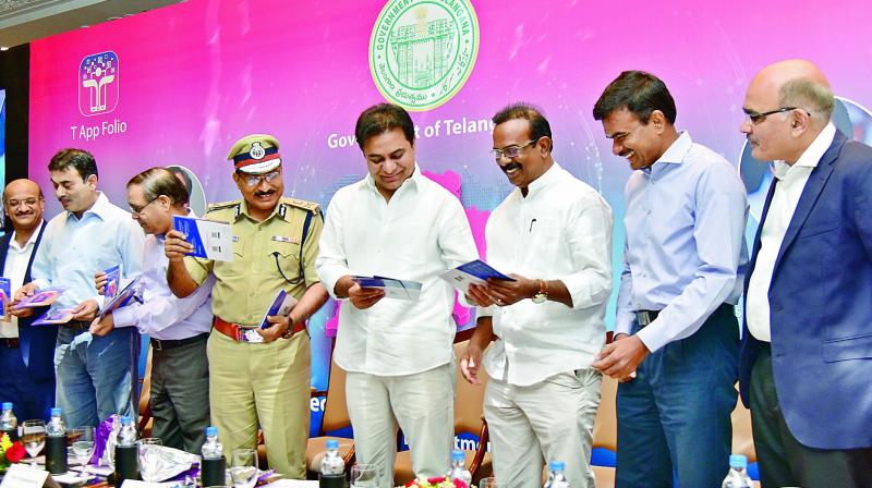 Left:  DGP M. Mahendar Reddy and minister for IT K.T. Rama Rao at the launch of T App folio on Wednesday. (Photo:DC)