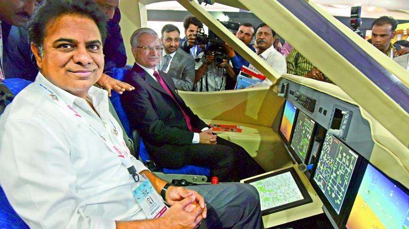 Telangana industries minister K.T. Rama Rao sitting in a model cockpit at Wings India on Thursday. (Photo:DC)