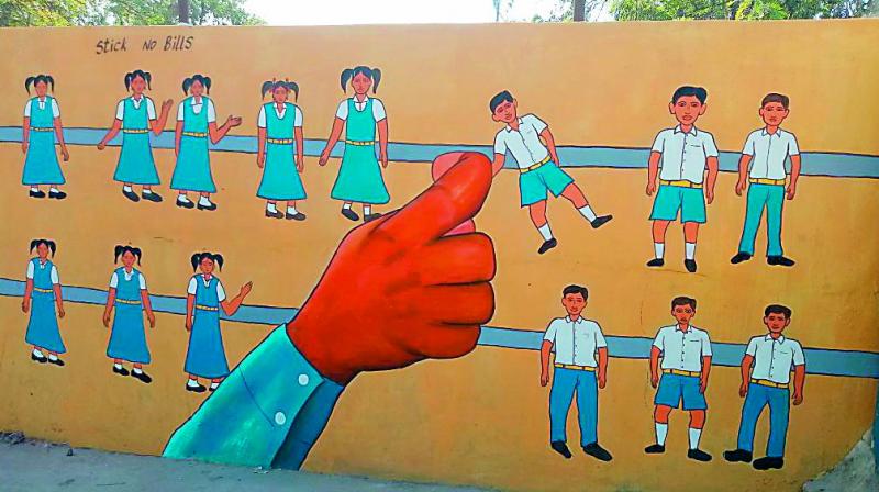 Government school wall painted with a series of boy and girl figures arranged to look like an abacus containing the beads in a straight line