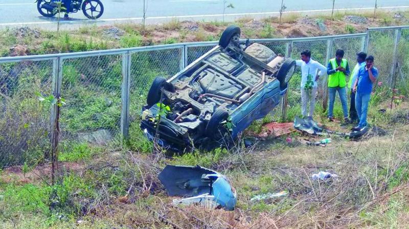 A car that overturned on the Outer Ring Road at Abdullahpurmet on Sunday.