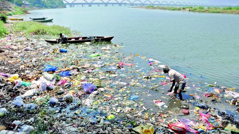A file picture of garbage and plastic piled up on the banks of river Godavari in Rajahmundry.