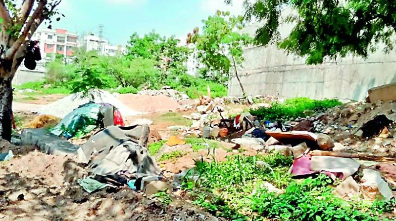The area which was supposed to be a park is being dumped with debris at Kondapur.(Photo: DC)