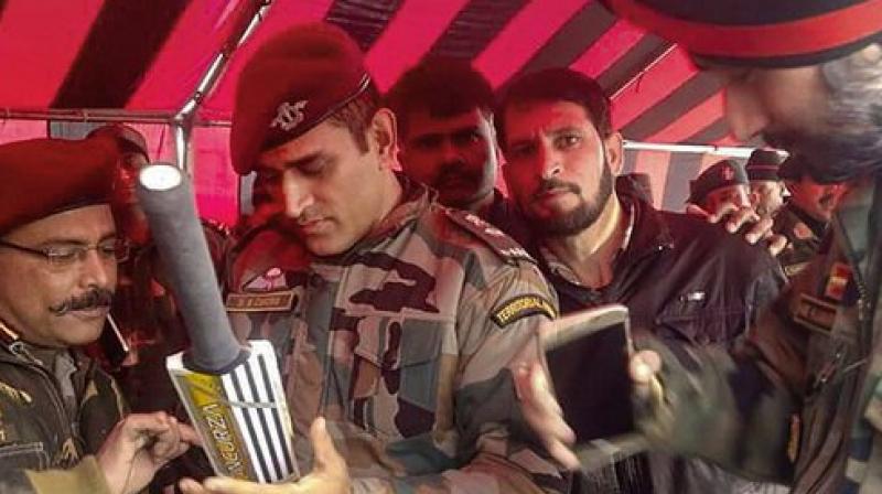 Lt Colonel MS Dhoni gives an autograph bat as his picture goes viral; see pic
