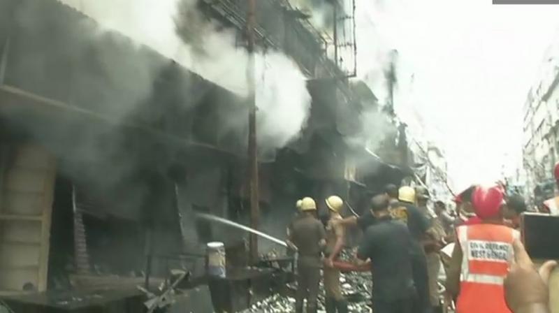 Thirty fire tenders have been pressed into service to douse the fire at the over 60-year-old building. (Photo: Twitter | ANI)