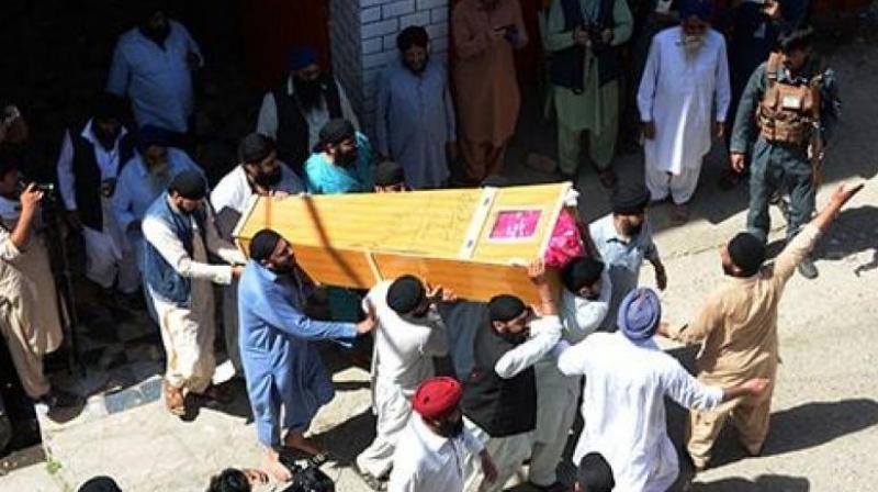 Afghan Sikhs carry the coffin of one of the 19 victims of a suicide attack in Jalalabad. (Photo: AFP)