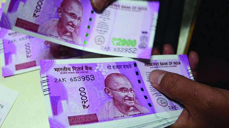 Rupee drops 32 paise, may stay weak if crude spikes