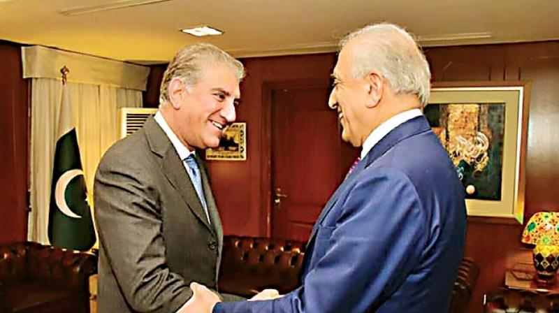 Pakistans Foreign Minister Shah Mahmood Qureshi (L) meets US envoy Zalmay Khalilzad -- the US Special Representative for Afghanistan Reconciliation -- in Islamabad 	(Photo:  AFP)