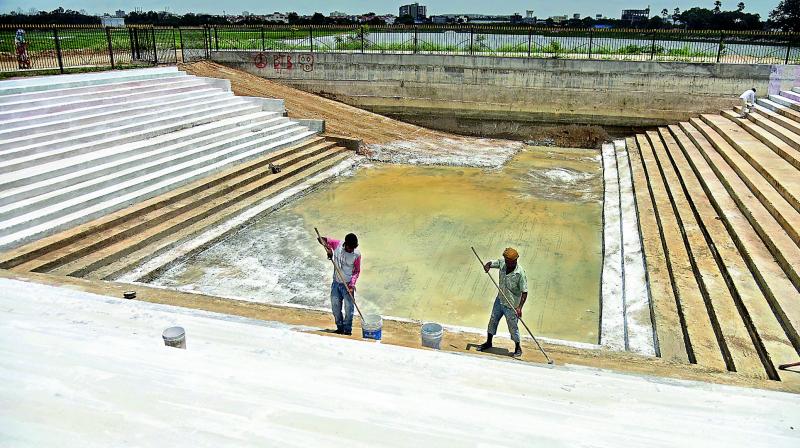 Ponds being cleaned up for Ganesh  immersion at Kapra lake.(Photo: S. Surender Reddy)
