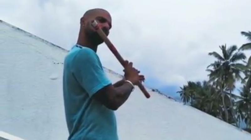 Fans in disbelief of Shikhar Dhawanâ€™s flute-playing skills; watch