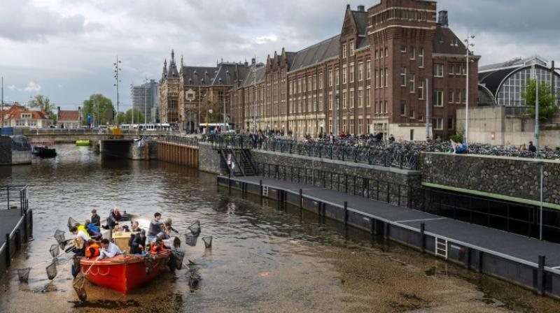 Amsterdam starts new tourist activity of fishing out plastic