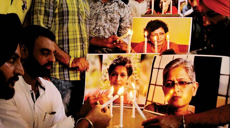 Members of the National Human Rights and Crime Control Organisation hold a candle-light vigil in Amritsar on Friday, to condemn the killing of journalist Gauri Lankesh	(Photo: PTI)