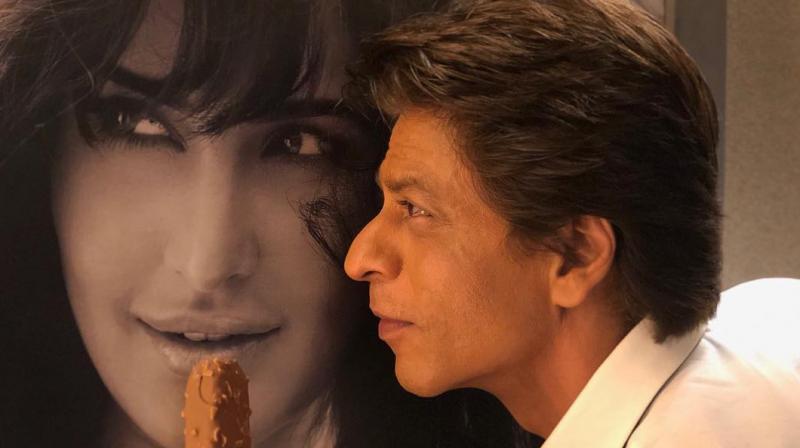Shah Rukh Khan with a photo of Katrina Kaif.