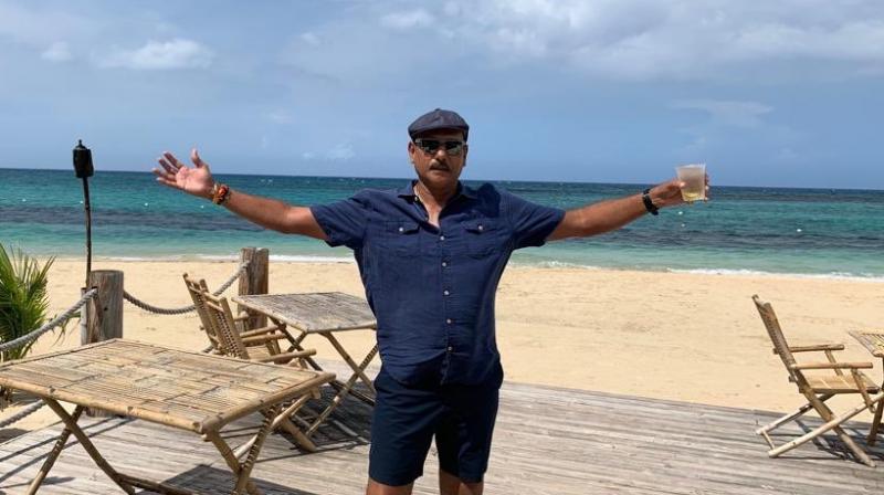Ravi Shastri gets trolled brutally for posting pic with \divine\ punch; see tweets