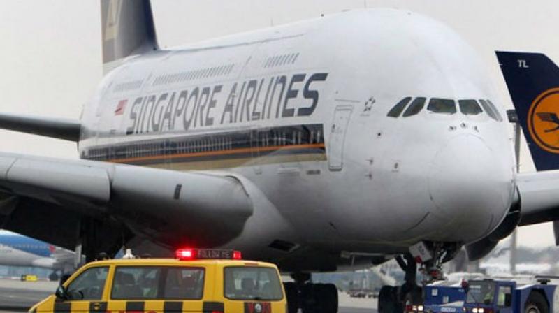 Singapore Airlines Ltd said it would launch the worlds longest commercial flight in October, a near-19 hour non-stop journey from Singapore to the New York area.