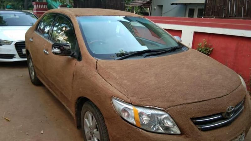 Want to keep your car cool? Cover it with cow dung like this Ahmedabad man