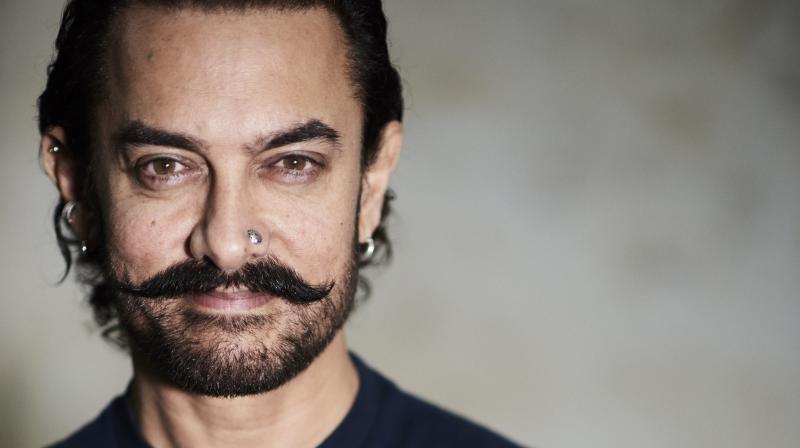 Watch: Aamir Khan amazes co-passengers by flying in economy class