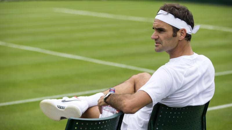 Roger Federer sits on his chair during a training session, at the All England Lawn Tennis Championships in Wimbledon. (Photo:AP)