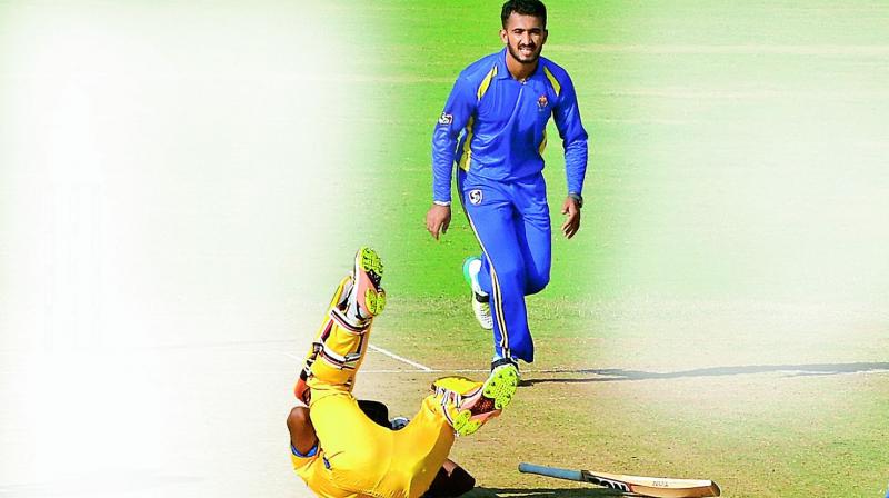 Tamil Nadus B. Aparajith stumbles after a head-on collision with Dinesh Karthik as Karnataka keeper C.M. Gautam takes the bail off to dismiss the batsman.	 E.K. Sanjay