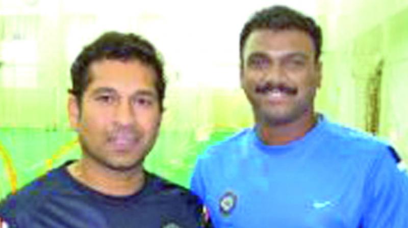 A file photo of Sachin Tendulkar with India Under-19 team strength and conditioning trainer Rajesh Sawant.