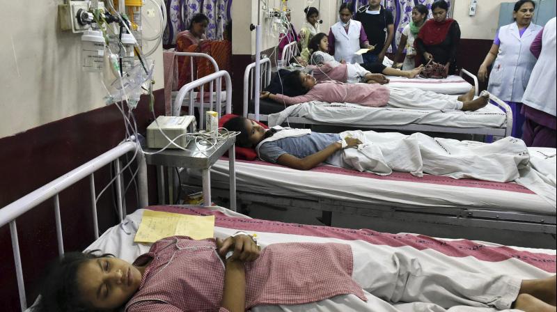 Students of the Rani Jhansi Sarvodaya Kanya Vidyalaya school receive treatment at a government hospital in New Delhi. (Photo: PTI)