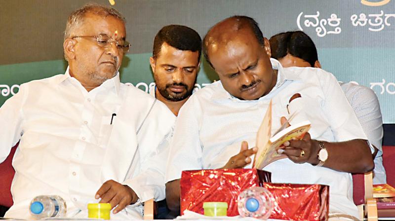 Chief Minister H.D. Kumaraswamy with minister G.T. Devegowda in this file photo 	(Image KPN)