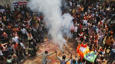 Bharatiya Janata Party supporters celebrate winning seats in the Uttar Pradesh Assembly elections in, Lucknow. (Photo: AP)