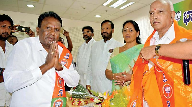 BJP state president B.S. Yeddyurappa welcomes Congress and JD(S) leaders who joined the party in Bengaluru on Monday.