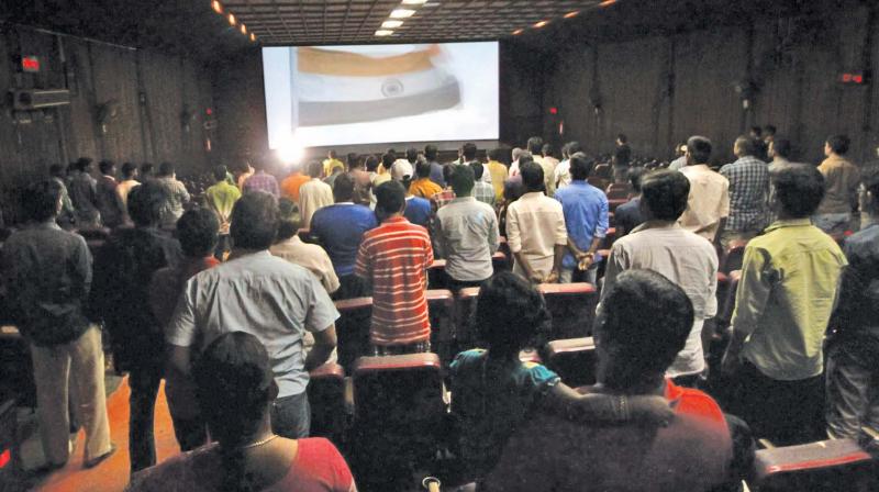 Audience at AVM Rajeswari theatre rise for the national anthem, after the Supreme Court mandated audience to do so on Wednesday (Photo: DC)