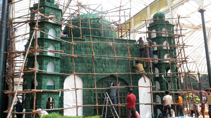 Preparations underway for the flower show on Republic Day  at Lalbagh, in Bengaluru on Wednesday. (Photo: DC)