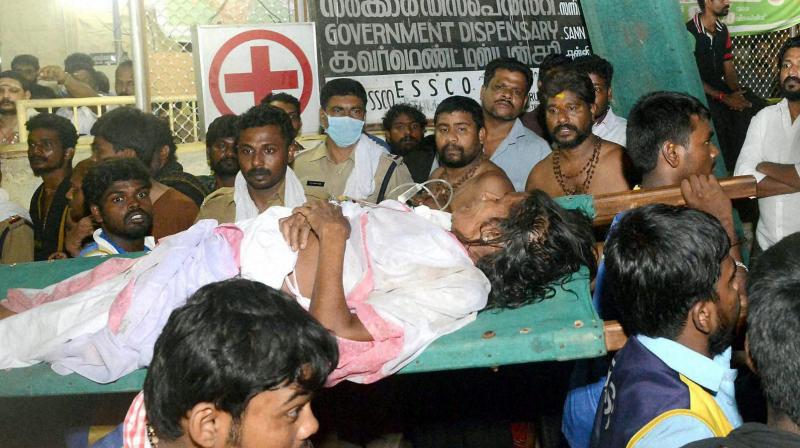 An injured devotee being taken to the hospital in Pamba after at least 25 persons were injured following a stampede in Sabarimala temple in Kerala. (Photo: PTI)