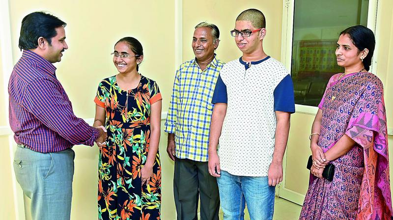 Mangani Deepika who stood second in the state and was ranked 24th overall is greeted by the dean D. Sankara Rao on her achievement after the Neet-2017 results were announced on Friday. Also seen are her father Chandra Prakash, 57th rank holder Nikhil along with his mother K. Bindhu Madhavi. Mangani and Nikhil are students of Sri Chaitanya Academy, Raman Bhavan campus (KPHB). (Photo:DC)