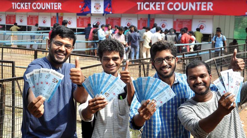 Fans show tickets for ISL final at Jawaharlal Nehru International Stadium in Kochi on Thursday. (Photo: SUNOJ NINAN MATHEW)