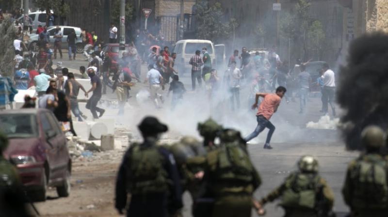 In addition to the 16 Palestinians killed, more than 1,400 were wounded, 758 of them by live fire, with the remainder hurt by rubber bullets and tear gas inhalation, according to the Gazan health ministry. (Photo: AFP)