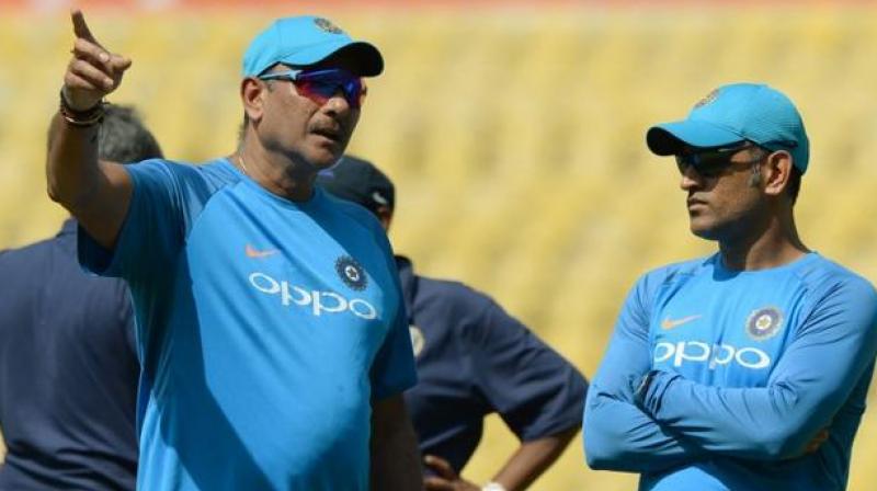 \People should look back at their career before commenting on Dhoni. The captain has a lot of cricket left in him and it is the duty of the team to back the legend,\ Shastri said. (Photo: AFP)