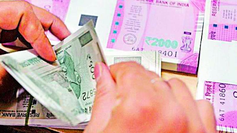 The rupee hit a record low of 70.86 a dollar in the intra-day trade before closing the day at 70.74 a dollar, down 0.20 per cent from its previous sessions close of 70.59.