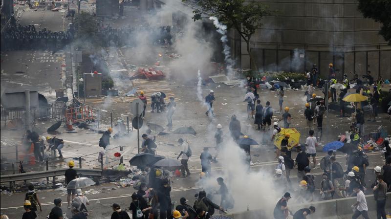 Police fired rubber bullets and beanbag rounds at the crowds, weapons that have not been widely used in recent history. Human rights groups criticised the tough tactics, while police said they were necessary against crowds of people who broke through barriers outside government headquarters and the legislature on Wednesday. (Photo: AP)