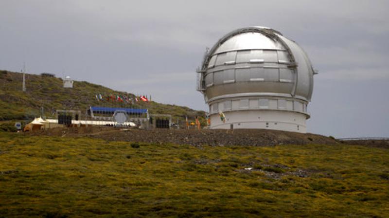 In this July 24, 2009, file photo, the Gran Telescopio Canarias, one of the the worlds largest telescopes, is viewed at the Observatorio del Roque de los Muchachos on the Canary Island of La Palma, Spain. An agreement has been reached for a giant telescope to be built in Spains Canary Islands if it cannot be put atop a Hawaii mountain. Telescope builder TMT International Observatory says Hawaiis Mauna Kea remains the preferred location for the $1.4 billion Thirty Meter Telescope. (AP Photo/Carlos Moreno, File)