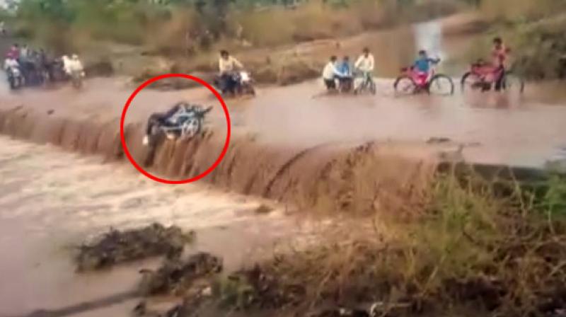 Man on bike swept away in flood water in Madhya Pradeshâ€™s Khargone