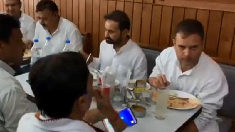 Watch! Rahul savours dosa in Patna after getting bail in defamation case