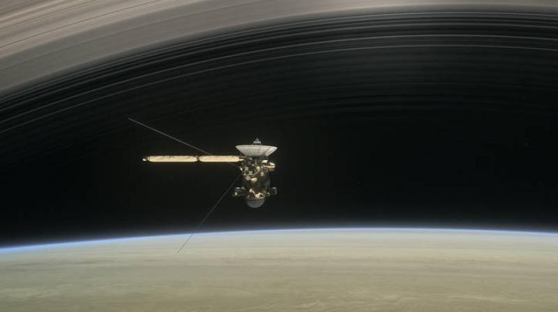 This artists rendering shows Cassini as the spacecraft makes one of its final five dives through Saturns upper atmosphere in August and September 2017. (Credits: NASA/JPL-Caltech)