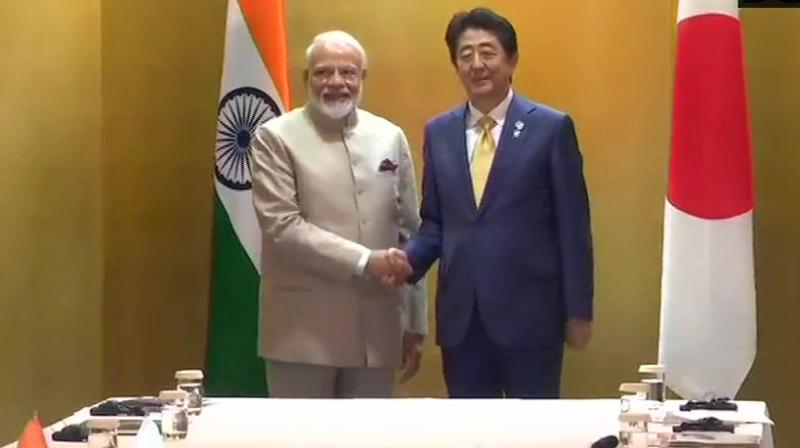 PM Modi, Shinzo Abe talk \mutual interests\ on sidelines of G-20 summit