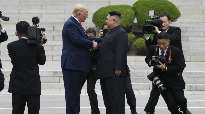 After shaking hands with Kim over the line that marks where their two countries and their allies fought each other to a standstill in the 1950-53 Korean War, Trump walked for several steps into North Korean territory, before another handshake. (Photo: AP)
